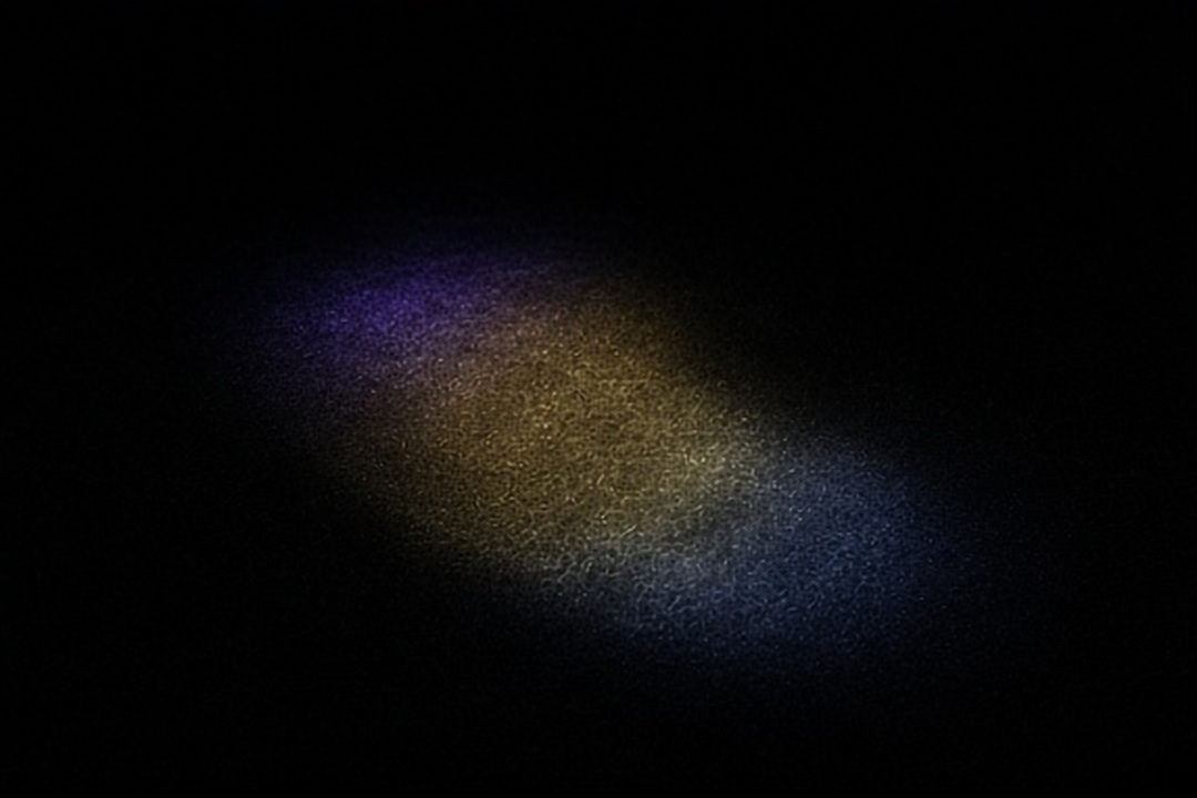 A group of upright glass forms in a narrow light field
